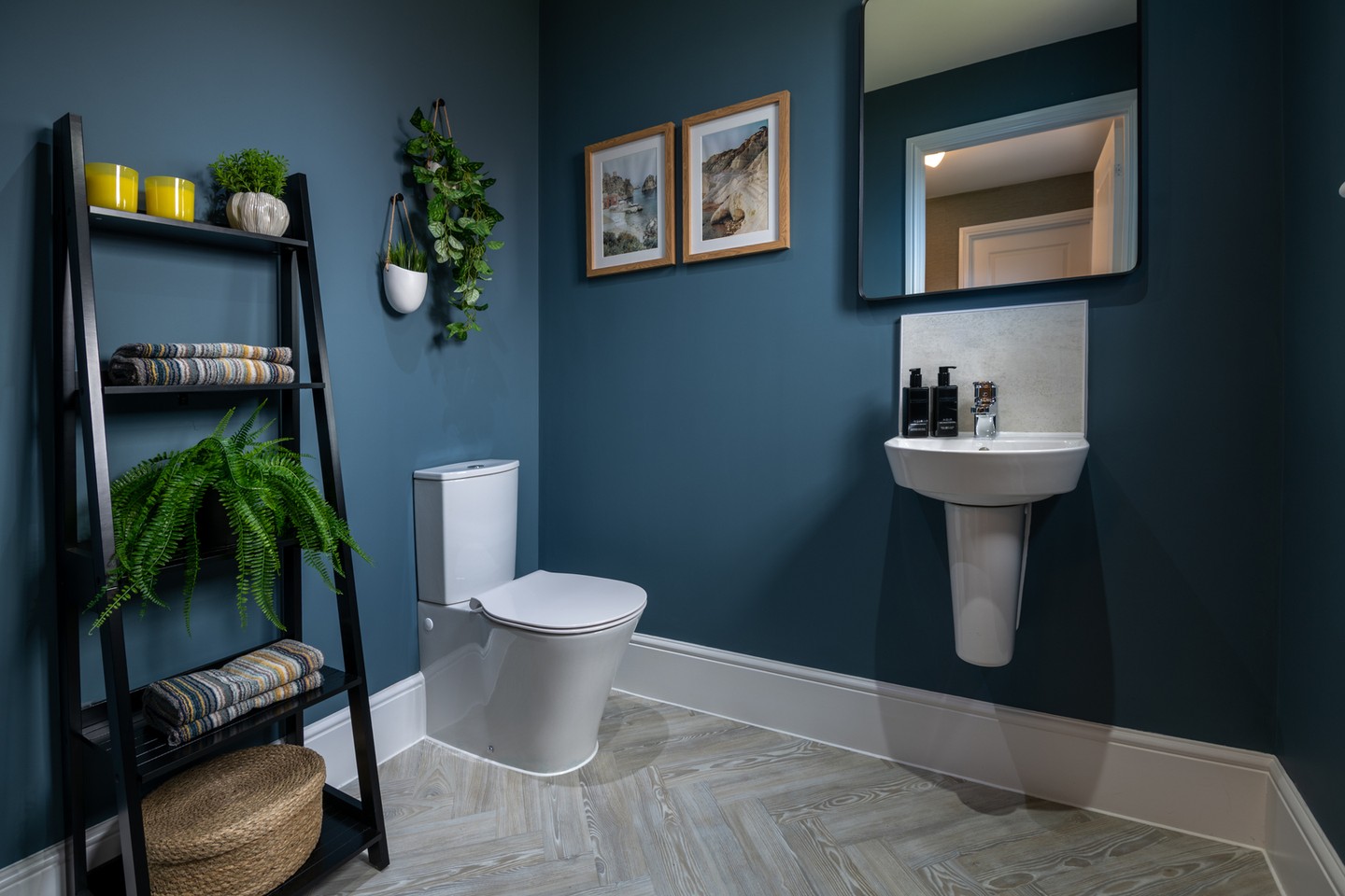 2. the Teal Towel Draped Over a White Sink with a Gold Faucet