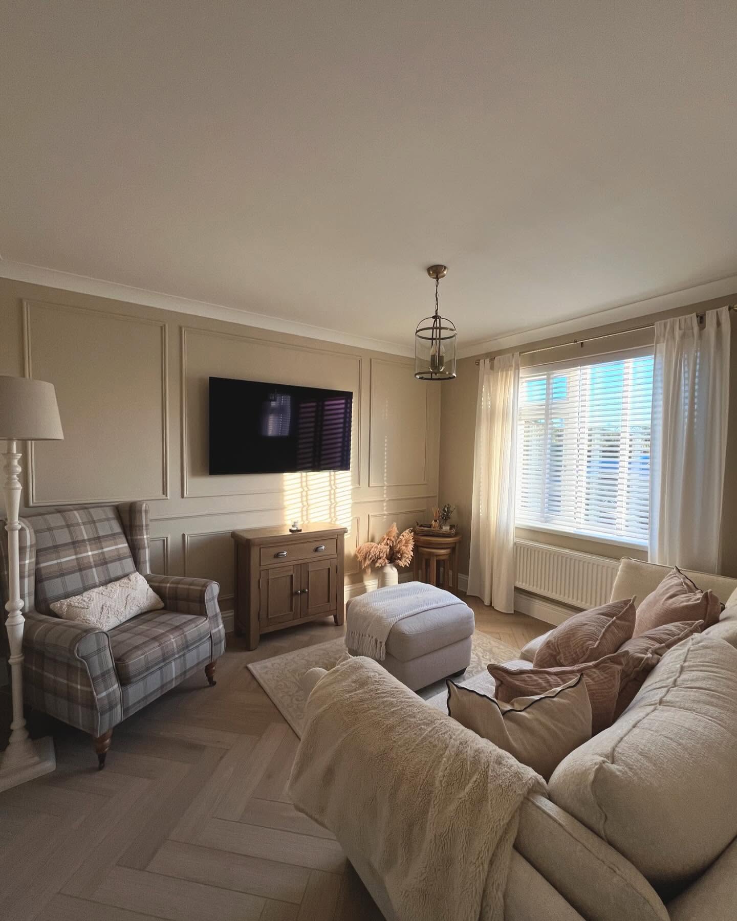 35. the Mosaic Of Muted Tones: a Living Room with a Geometric Coffee Table and Woven Baskets
