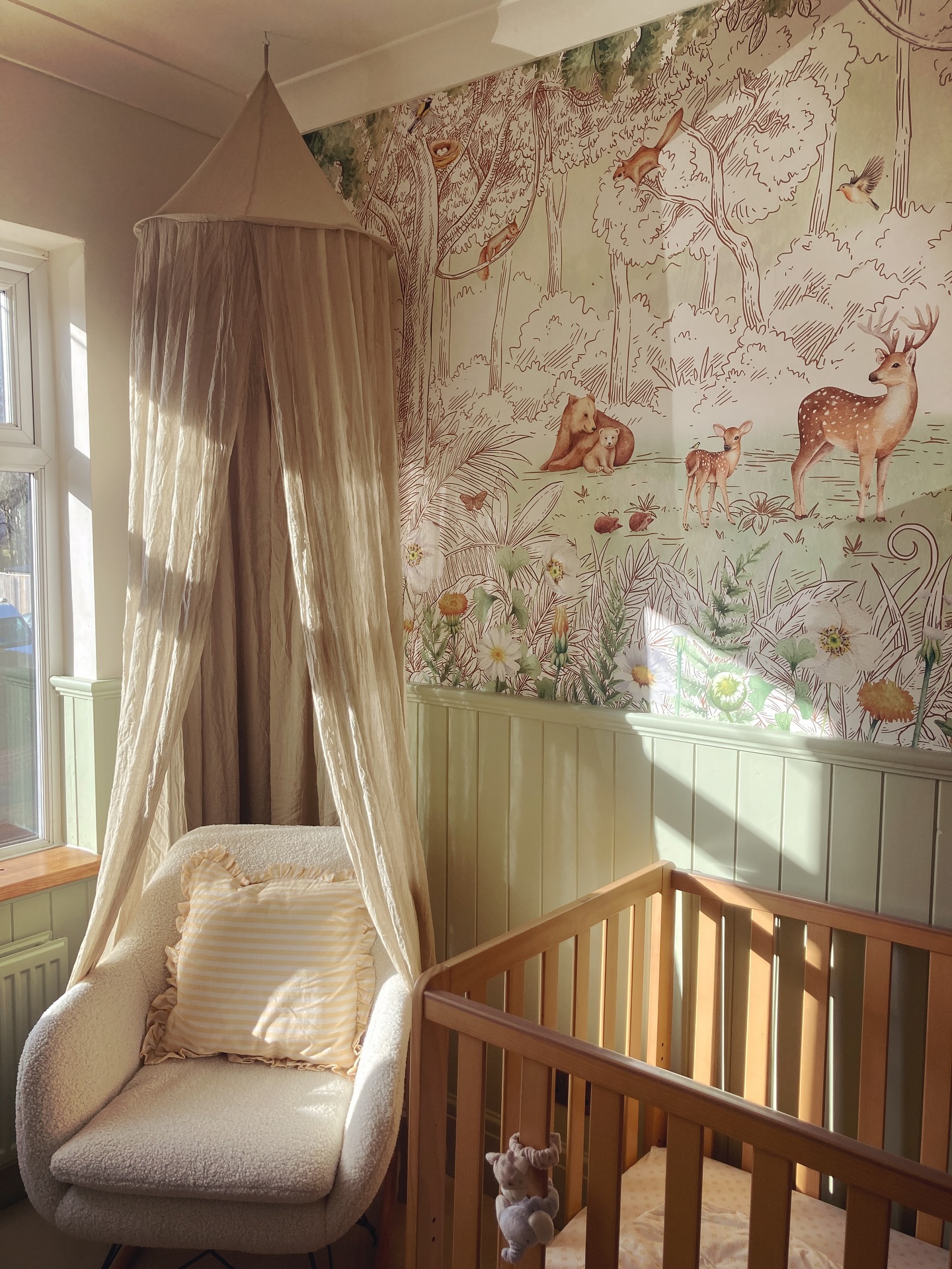 39. a Cactus Mobile and Starry Night Wallpaper Above a Sage Cot