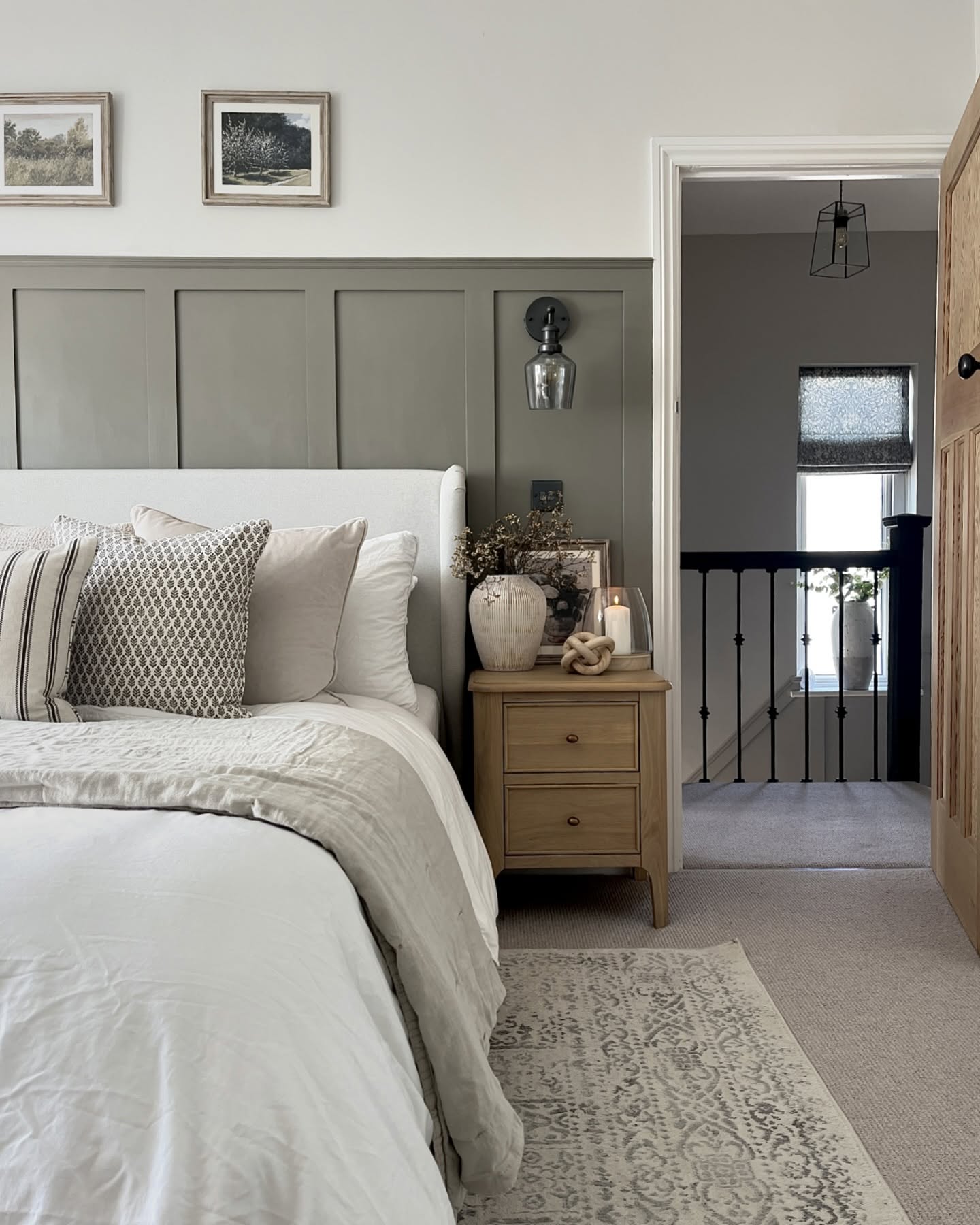 53. Soft Taupe Walls with Geometric Duvet Accents and Brass Pendant Light