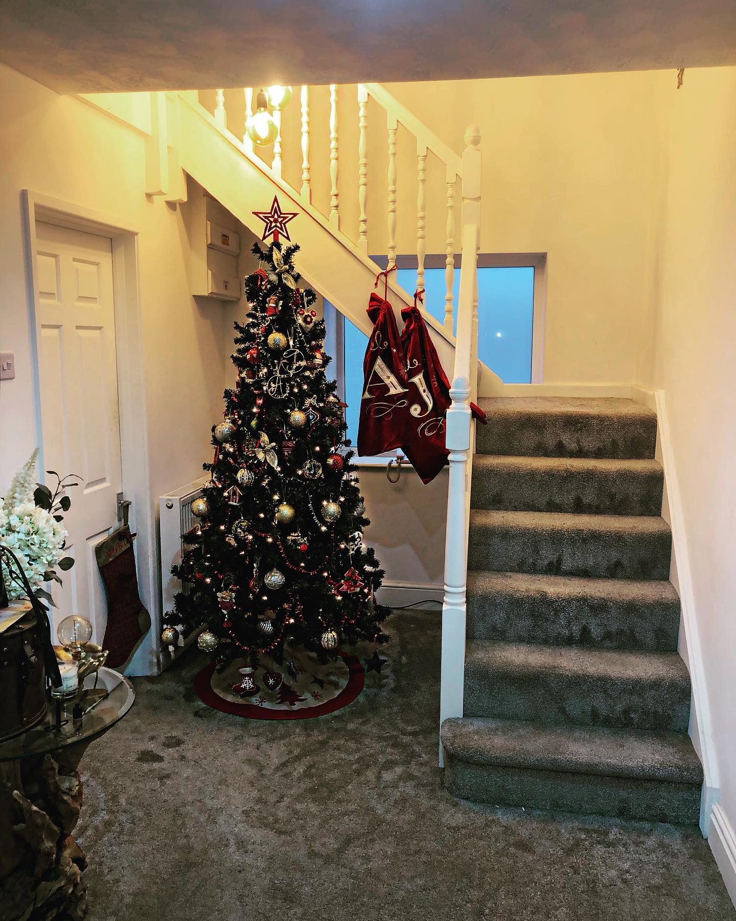 7. Crimson Ribbons and Pine Cones: a Festive Hallway Transformation