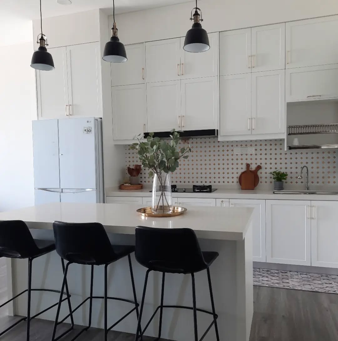 30. Moonlit Marble Countertops and Inset Cabinets: a Symphony Of White