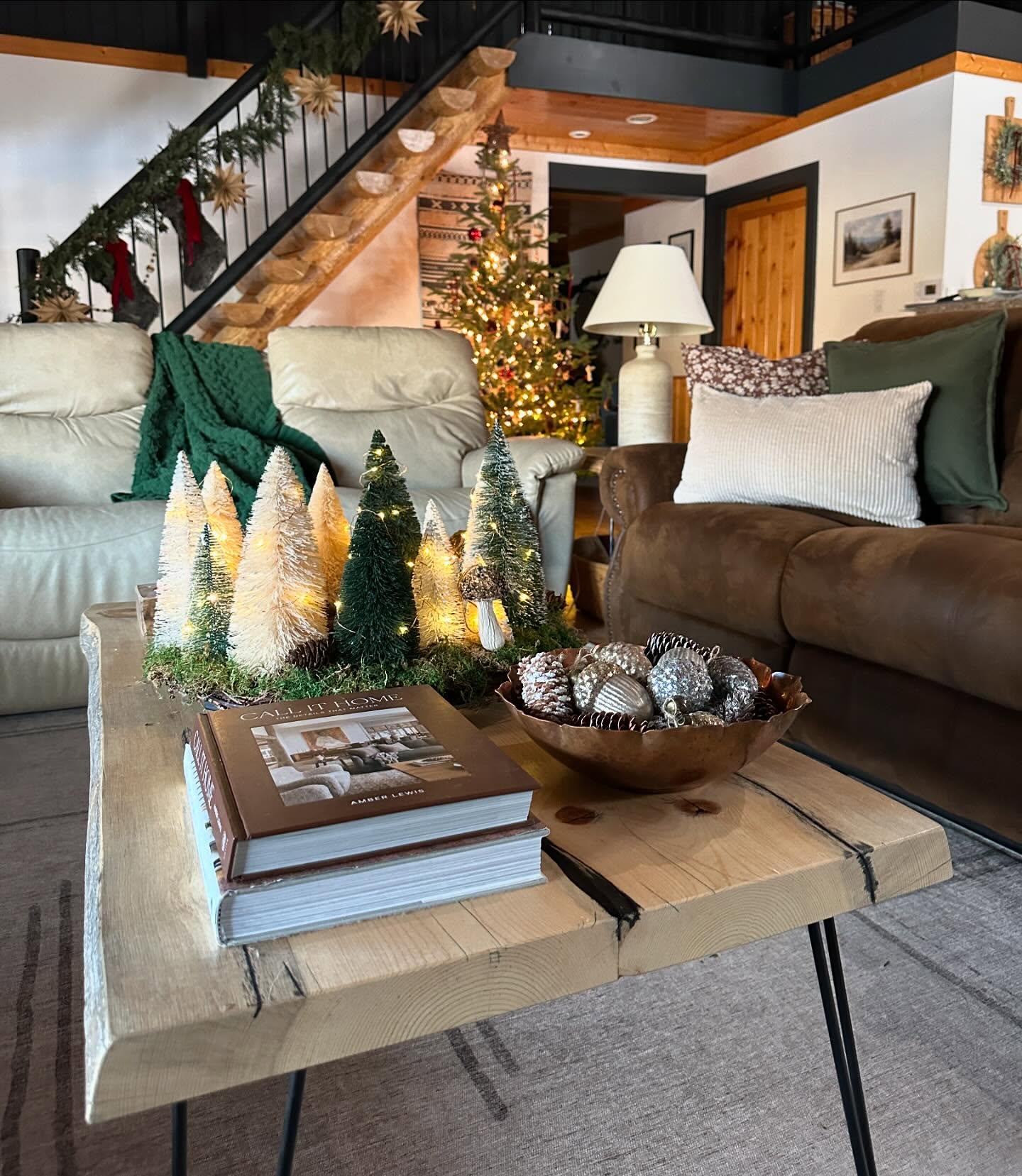 10. Festive Reindeer and Pinecones Amidst Rustic Wooden Trays on a Coffee Table