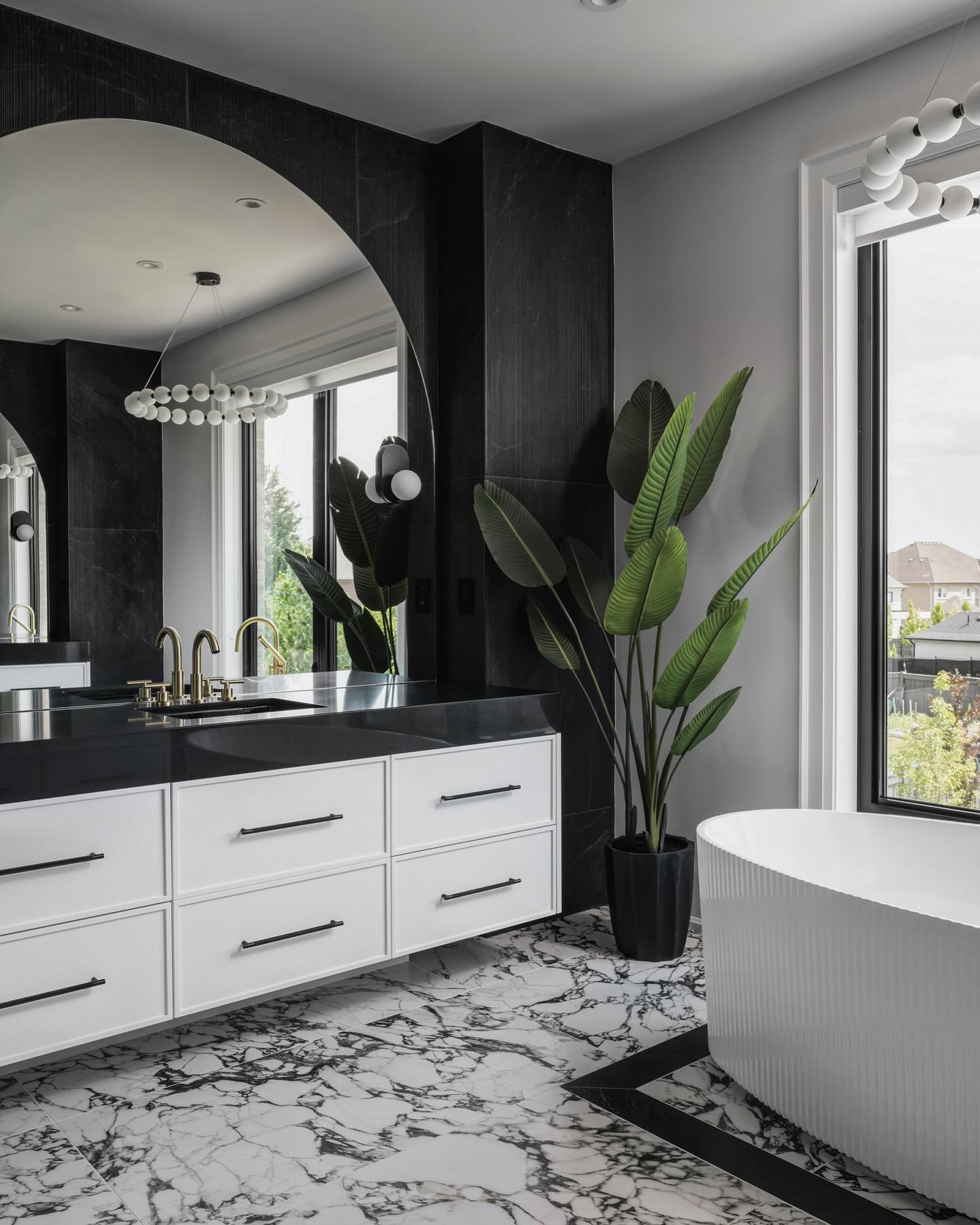 15. Moonlit Marble Mosaic: a Black and White Bathroom with Geometric Intricacy