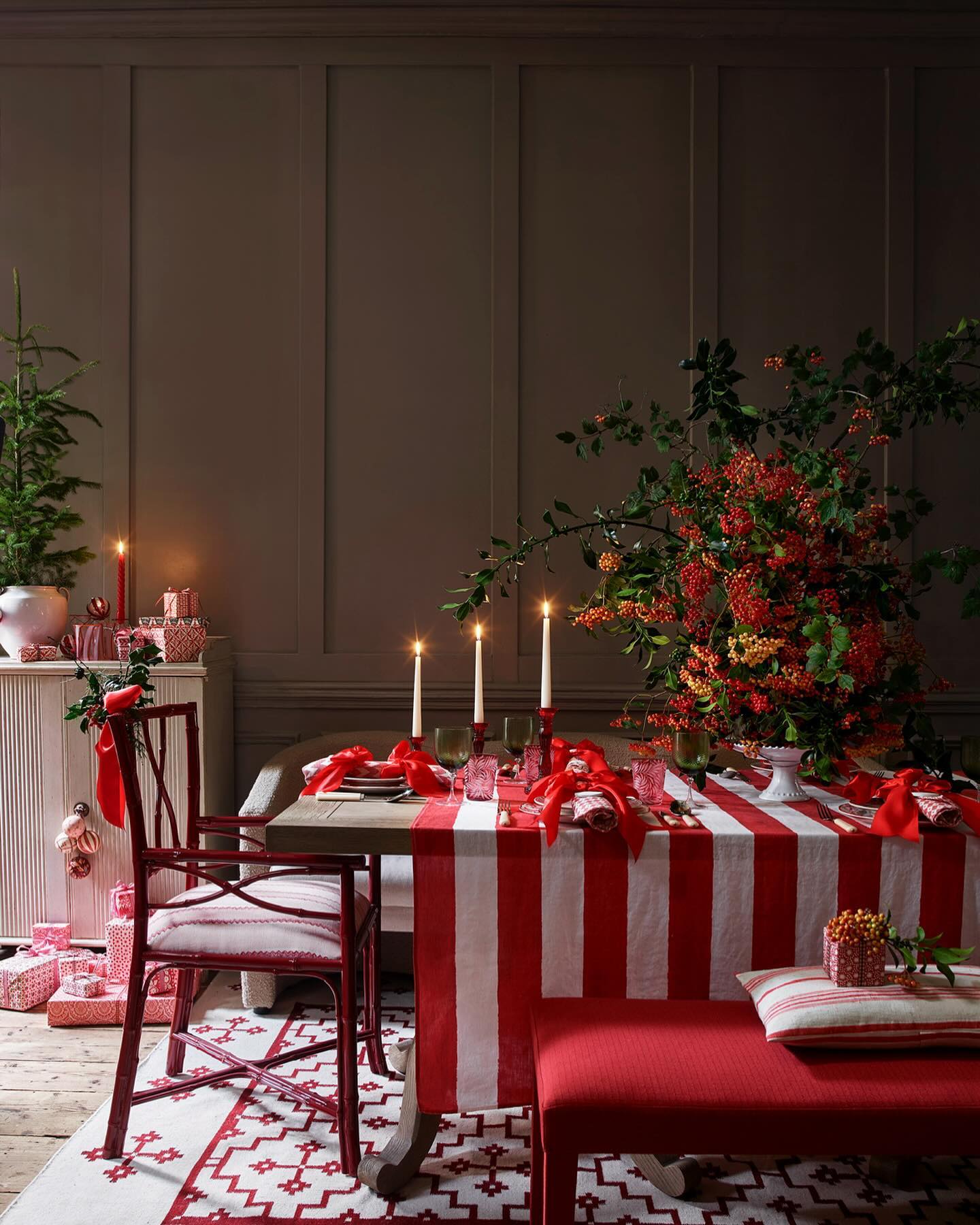 11. Crimson Ribbon Cascade: a Festive Garland Of Pine and Holly