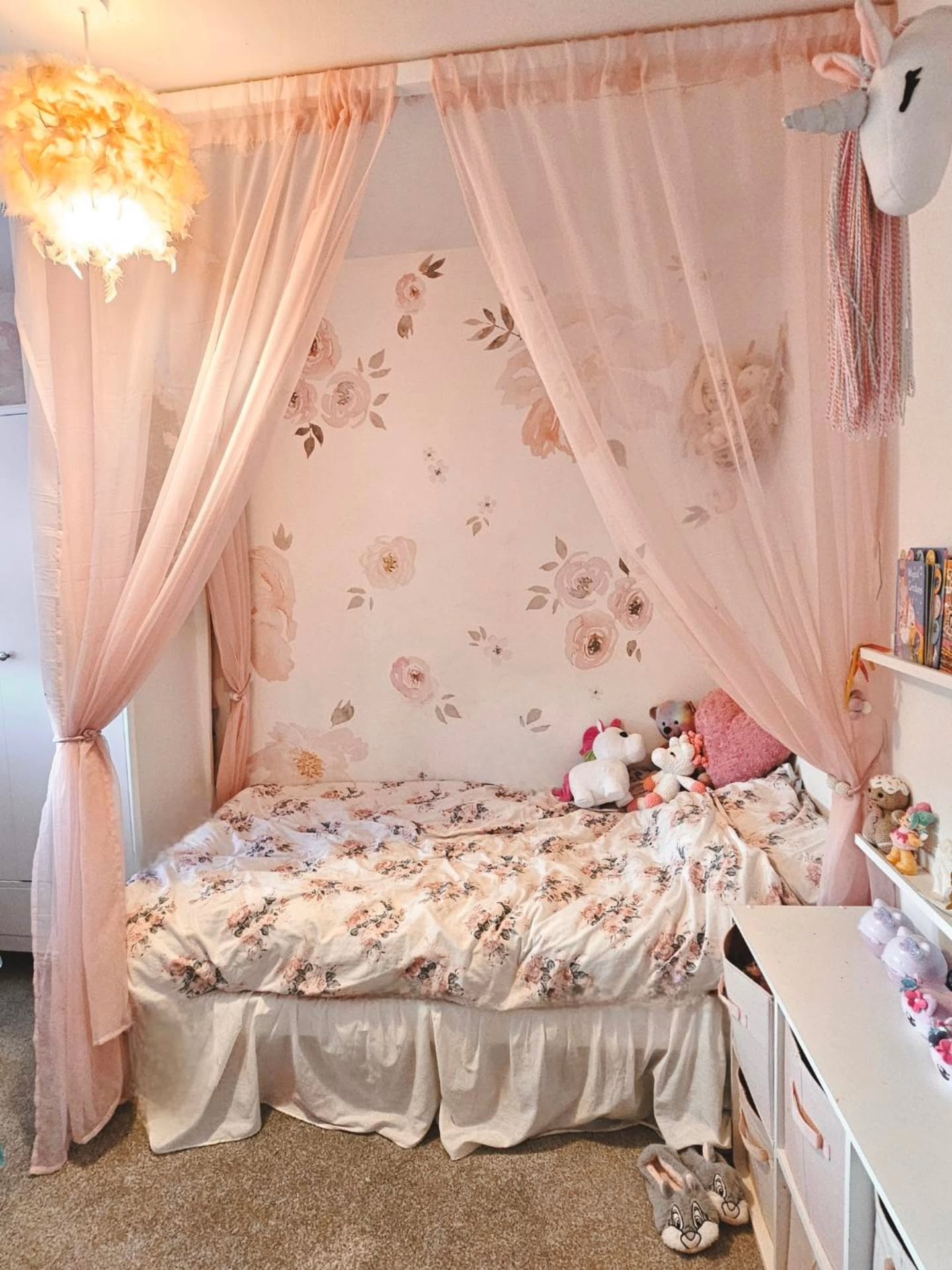 55. Fluffy Cloud Canopy Over a Blush Velvet Bed with Gold Accents