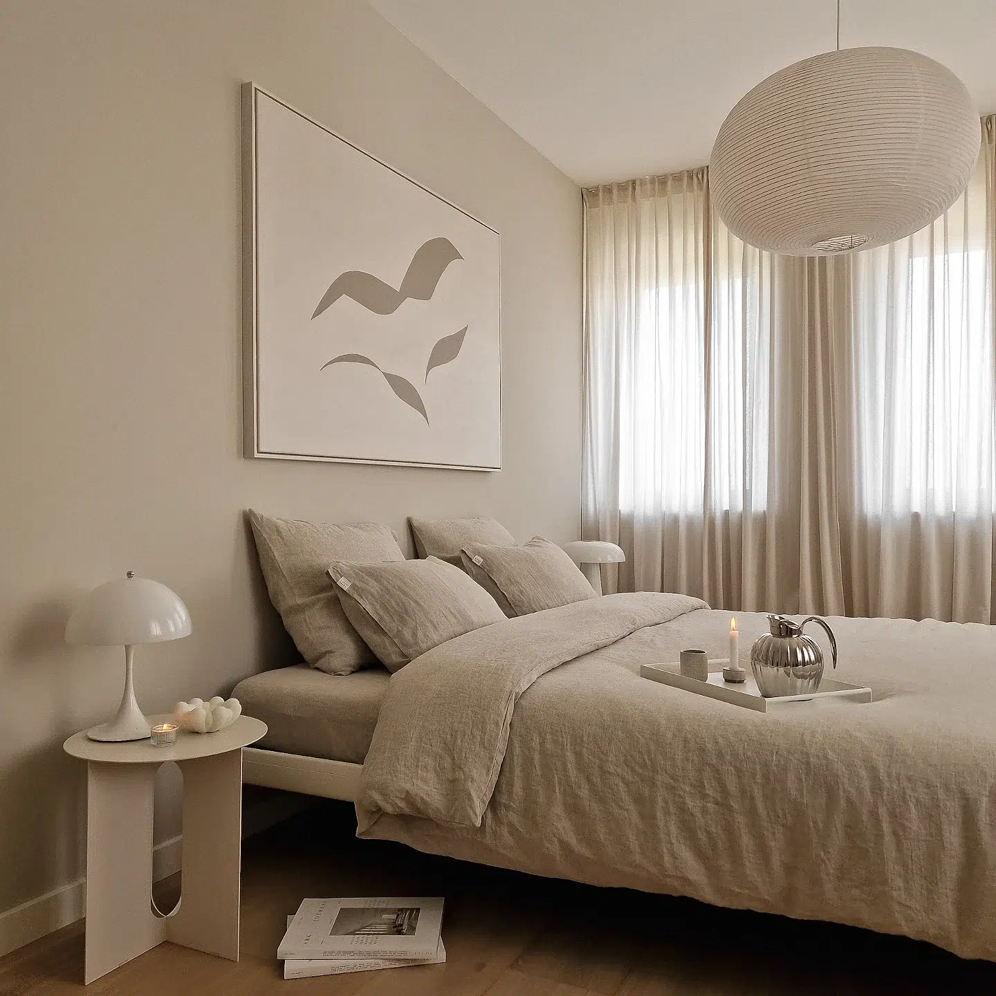 39. Subtle Sage Accents with Geometric Wall Art Above a Minimalist Bed Frame