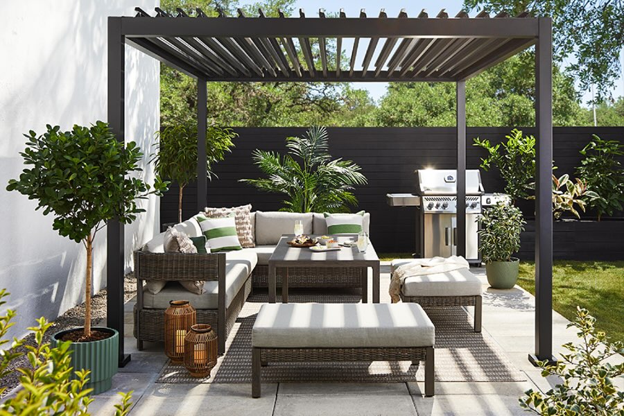 11. Patio Pergola with Woven Rope Accents and Geometric Tile Flooring