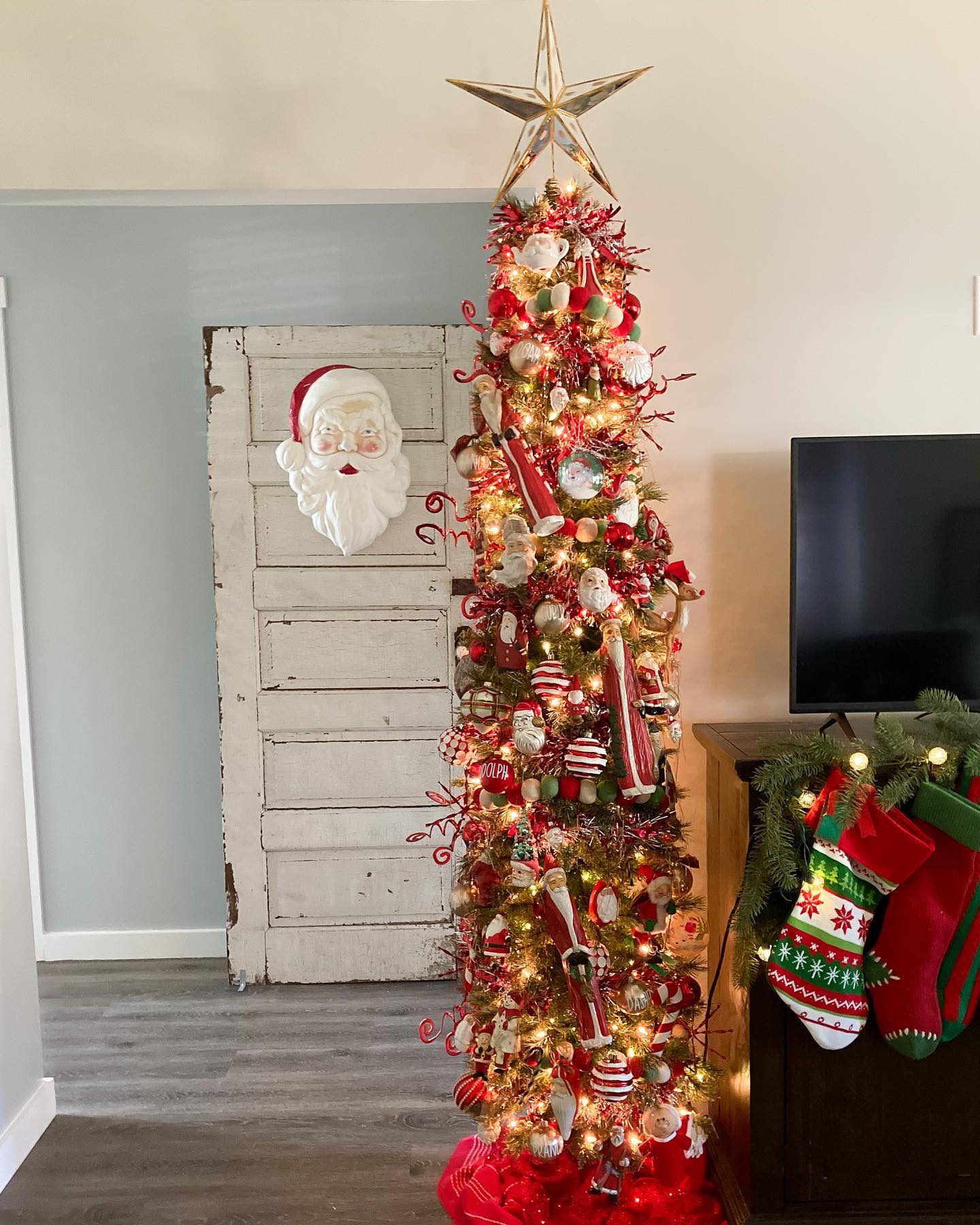 22. Twirling Ribbon Candy Canes and Luminous Snowflakes on a Crimson Wreath