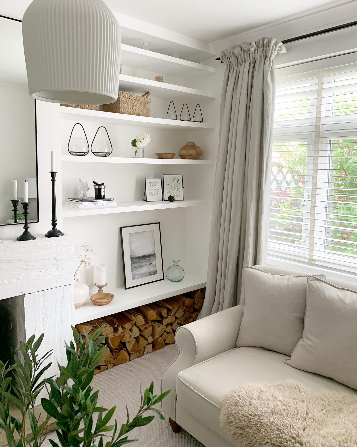 2. Suspended Glass Shelves with Geometric Metal Frames Embracing a Vintage Radio