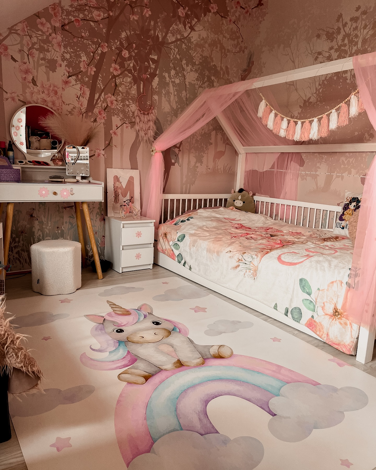 41. a Ballet Slipper Pink Canopy Bed with Velvet Cushions and Floral Wall Accents