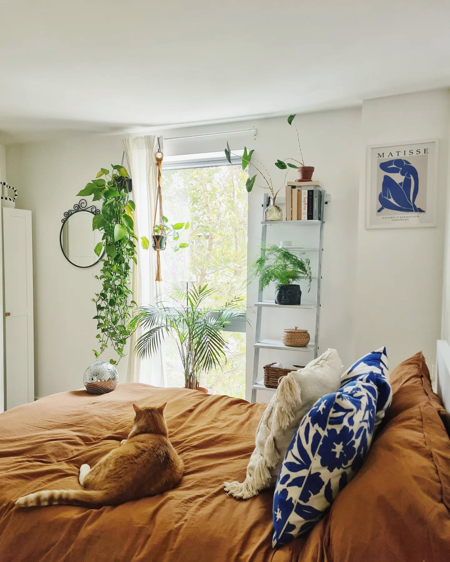 9. Cozy Nook with a Floating Bed and Geometric Wall Accent