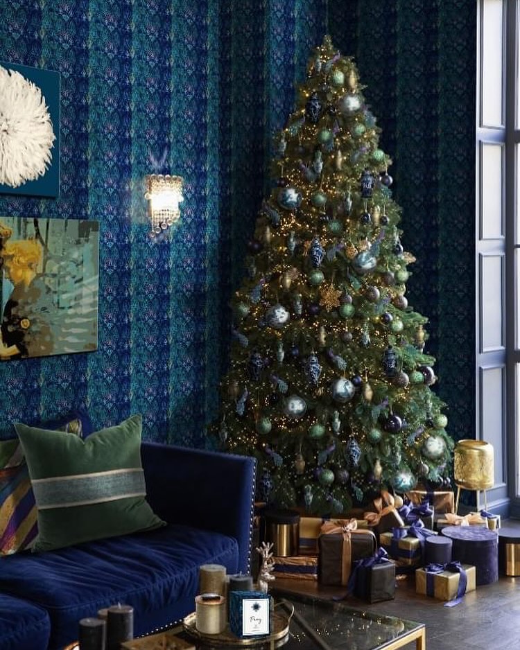2. a Cobalt Cascade Of Ornaments Draped Over Frosted Pine