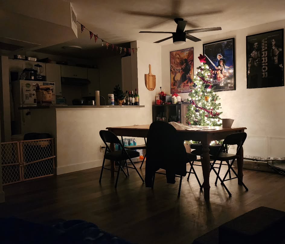26. a Glittering Garland Of Silver Bells Draped Over a Compact Bookshelf
