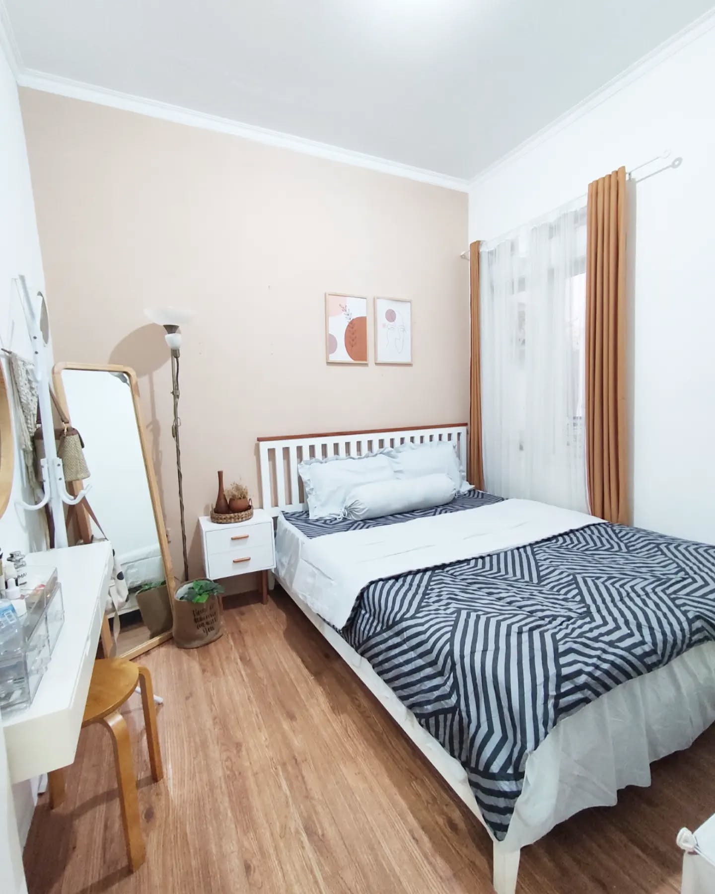 4. Cozy Nook with a Canopy Bed and Heart-shaped Pillow In a Soft Blue Palette