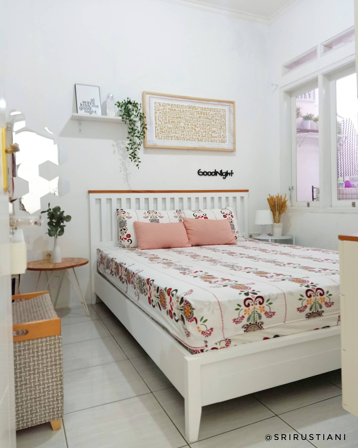 17. Cozy Nook with a Suspended Bed and Geometric Wall Accents