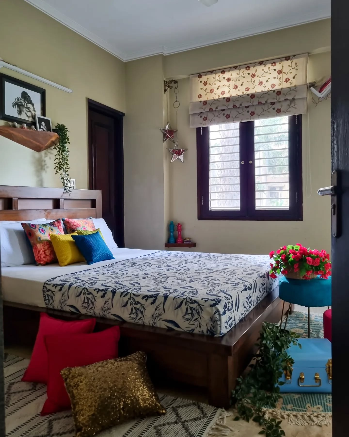 7. Cozy Nook with a Canopy Of Twinkling Fairy Lights and a Bold Red Accent Wall