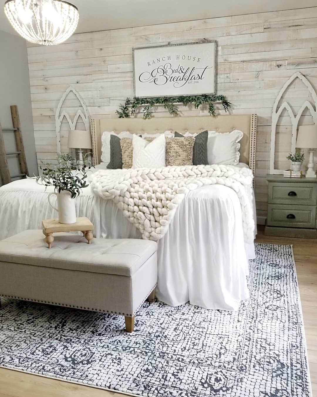 34. Farmhouse Charm with a Woven Basket Wall Accent and Vintage Lantern Nightstand