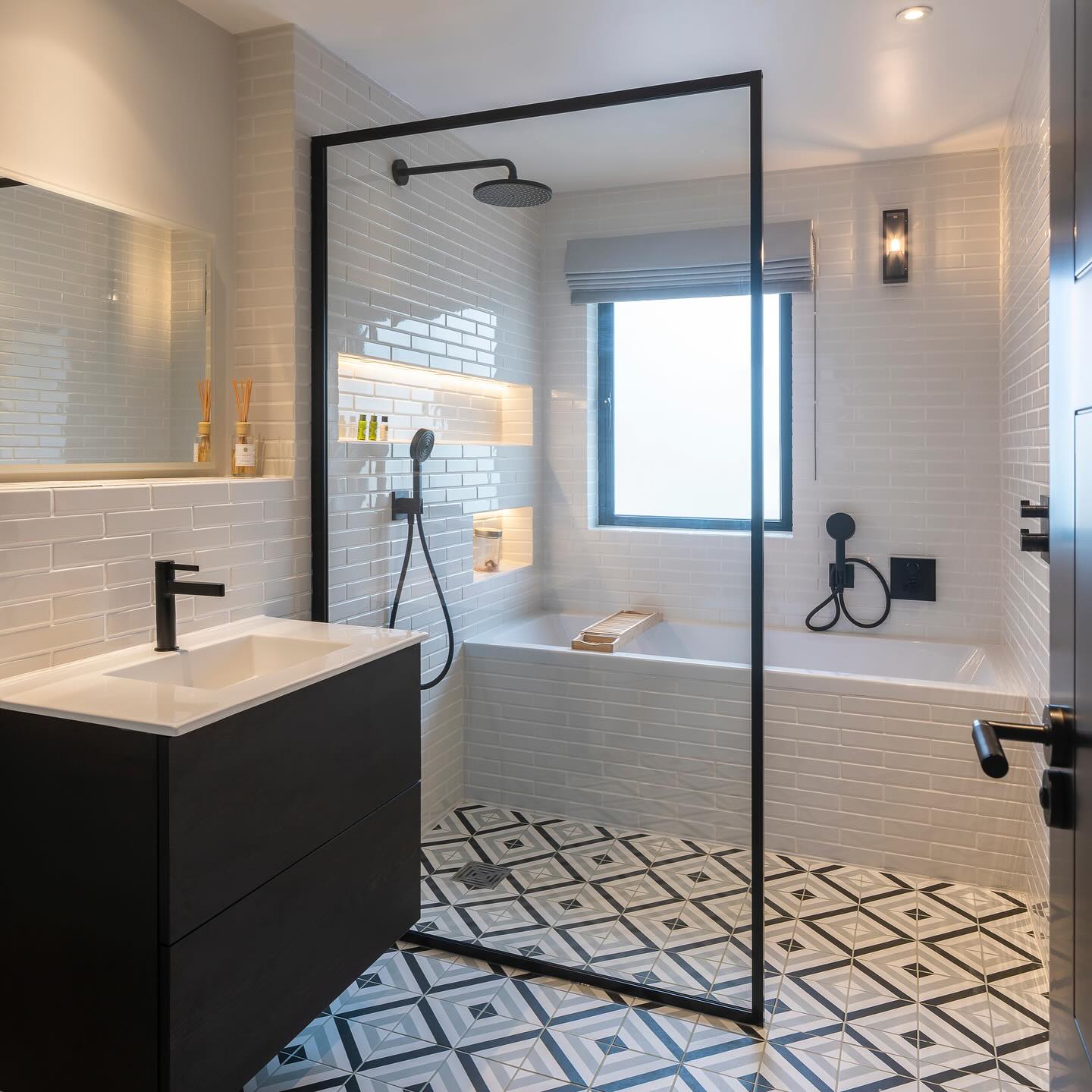 4. Geometric Monochrome Tiles and Floating Sink Symphony