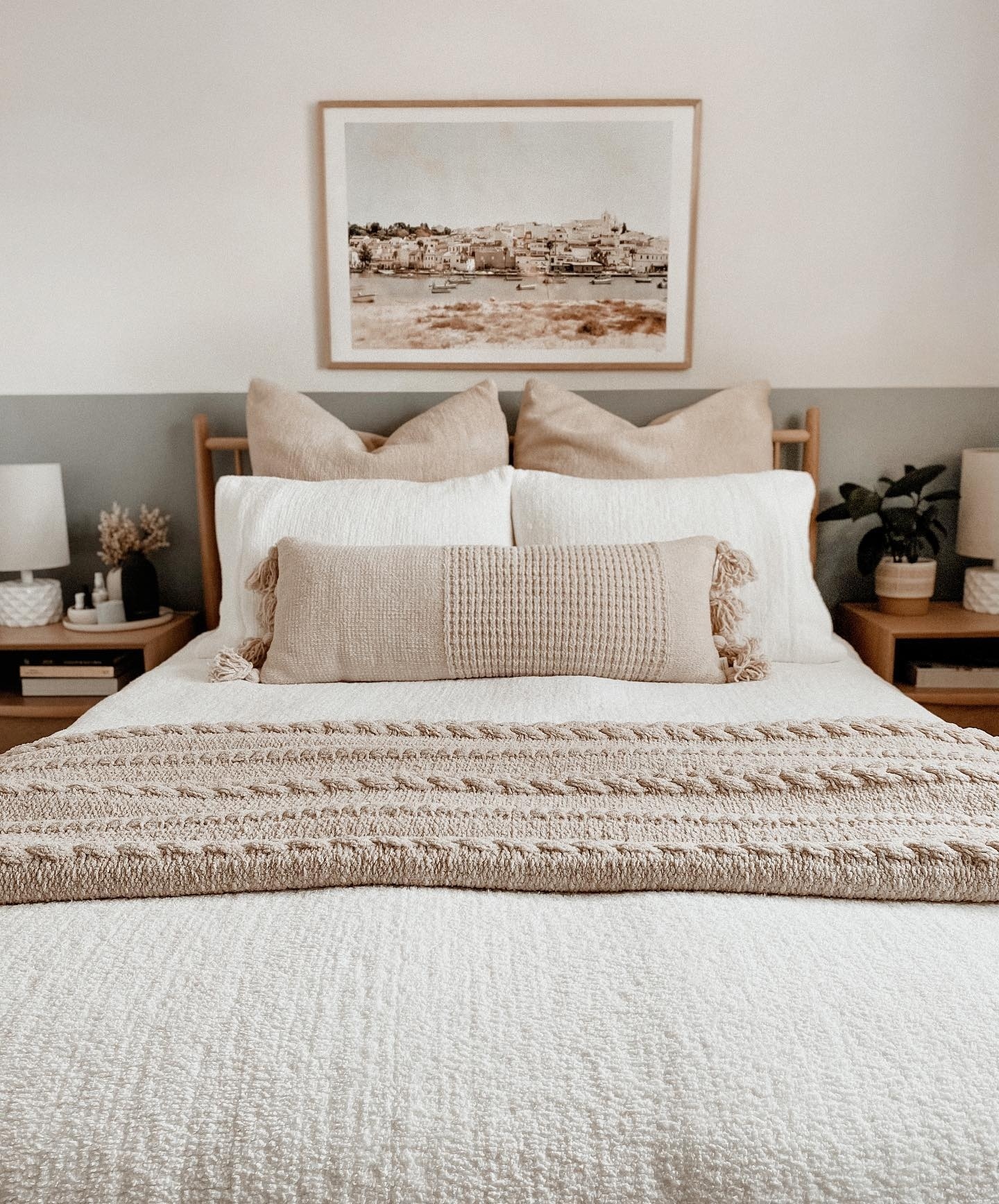 21. Soft Taupe Walls Embracing a Minimalist Bed with Geometric Quilt Patterns