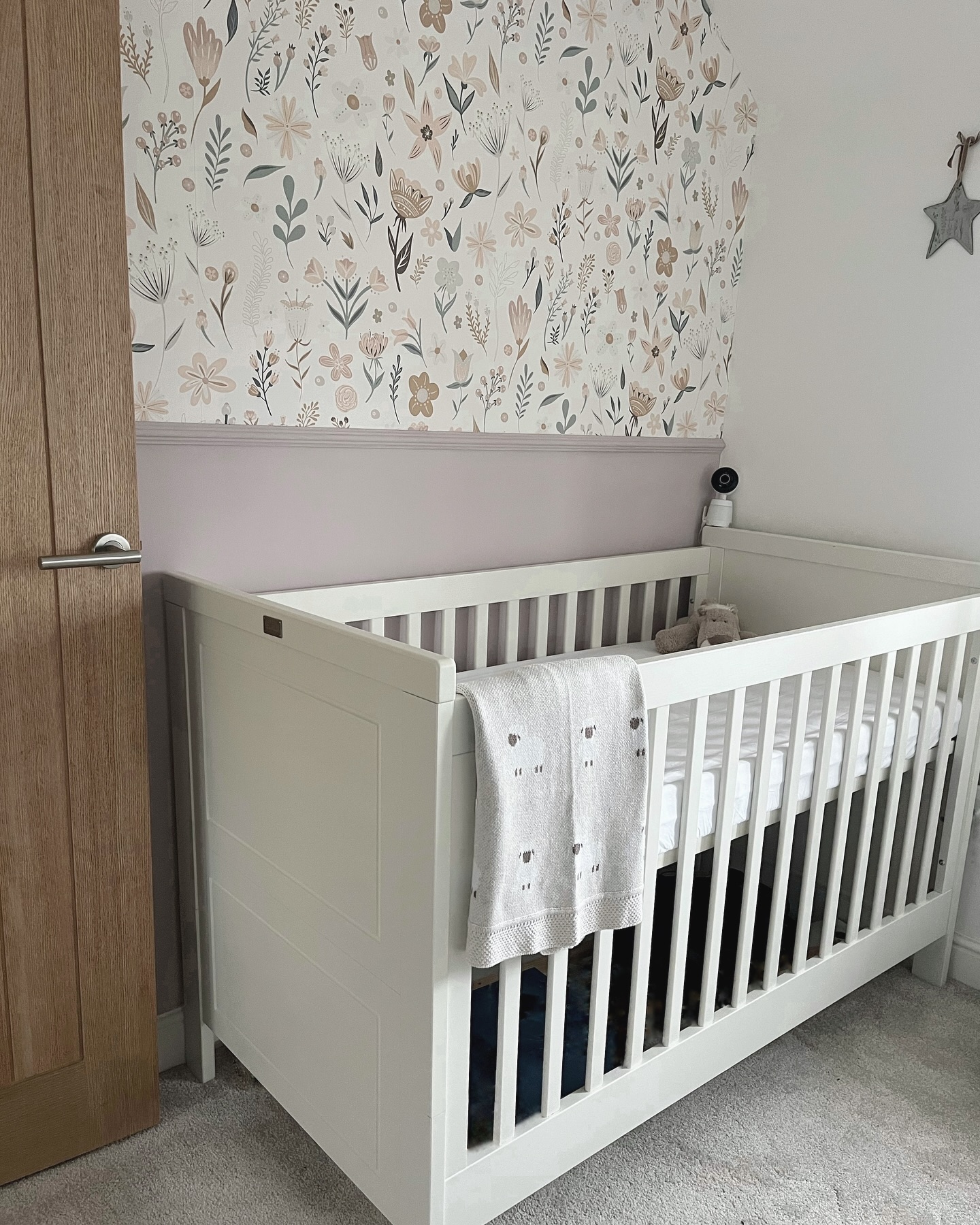 11. Moonlit Whispers: a Celestial Mobile and Soft Pastel Palette Nursery