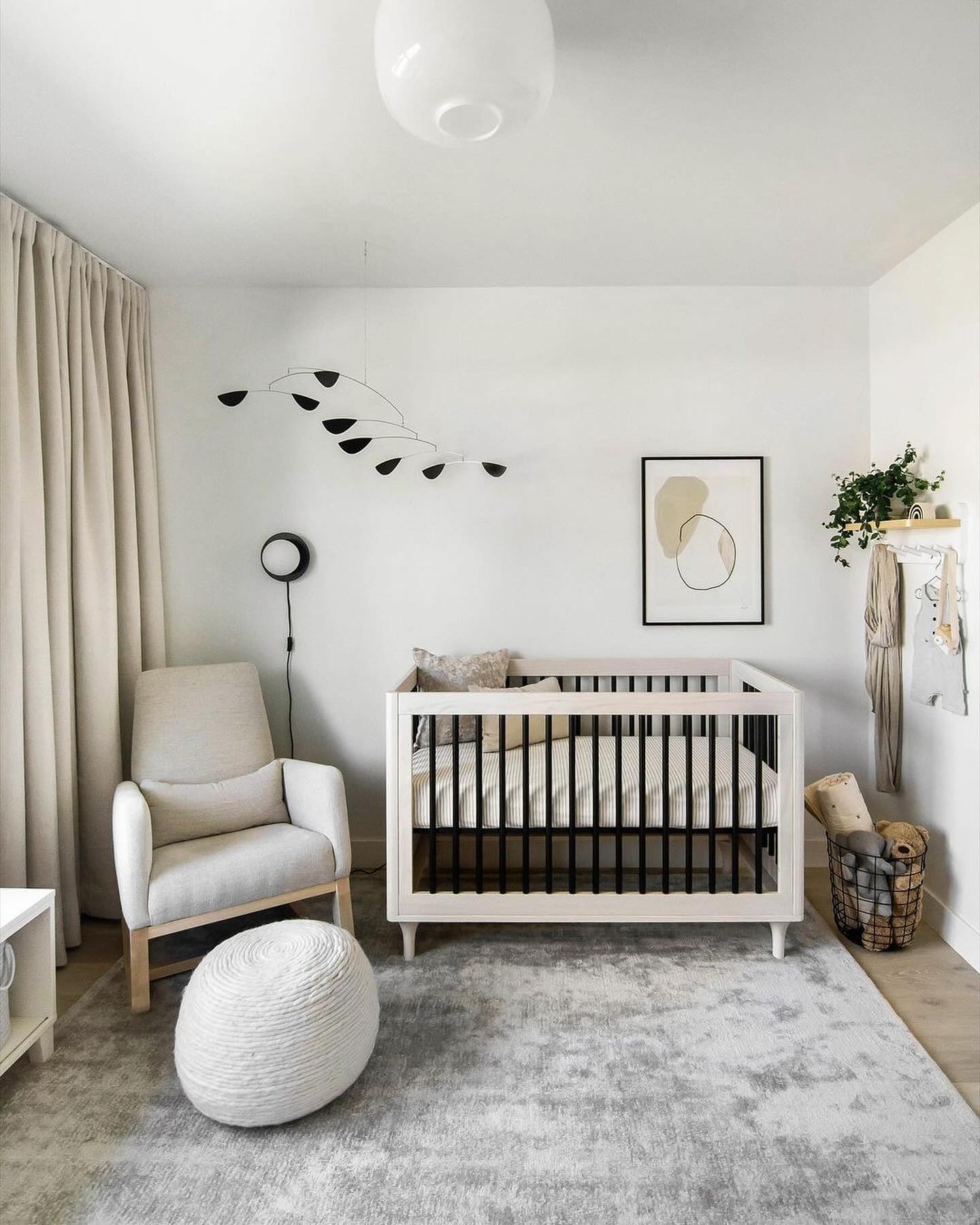 32. the Soft Glow Of a Single Pendant Over a Crib with Geometric Wall Art