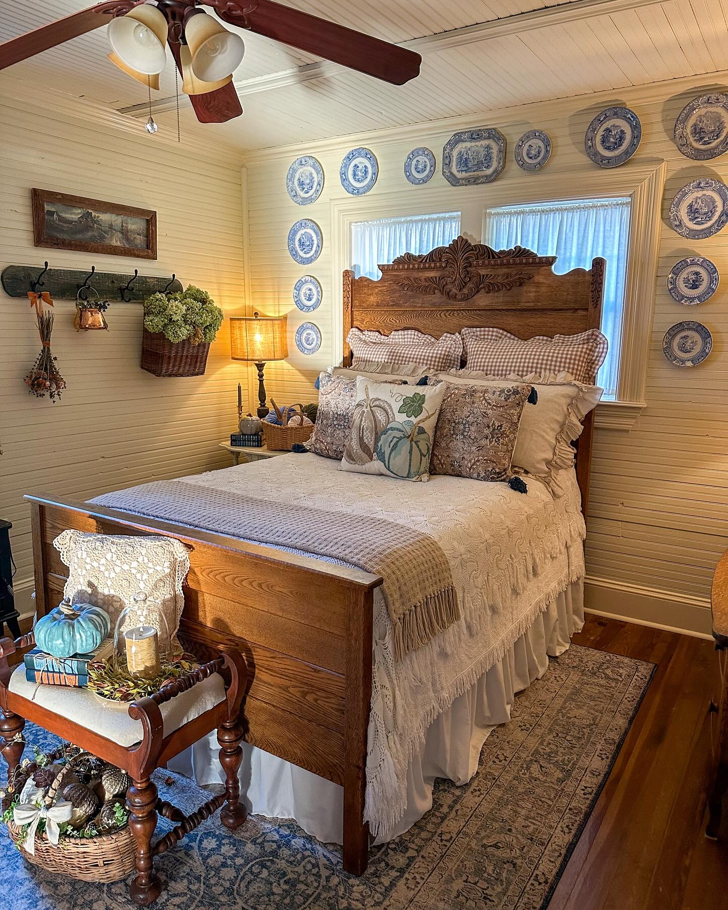 14. the Rustic Charm Of a Weathered Barn Door Headboard with Mason Jar Sconces