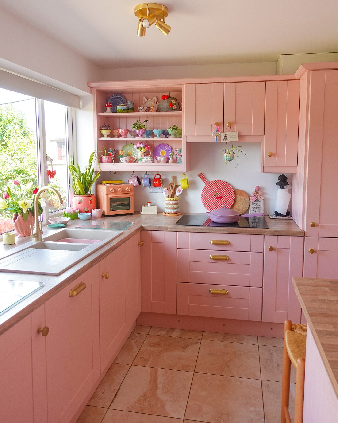 24. a Ballet Slipper Pink Island with Vintage Brass Faucet and Geometric Backsplash
