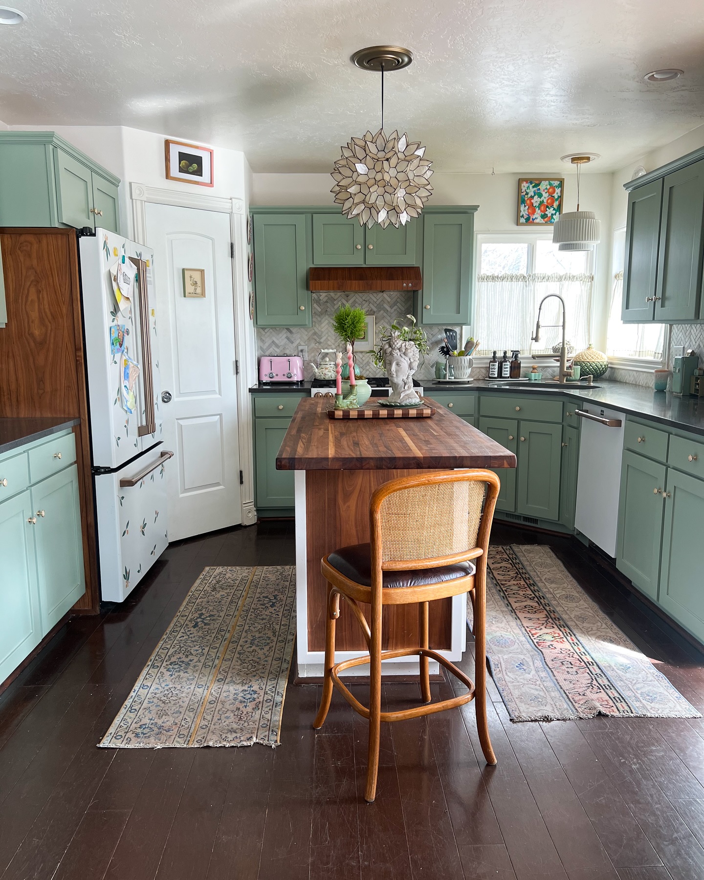 10. Verdant Vines and Copper Accents: the Kitchen Where Nature Meets Metallic Charm