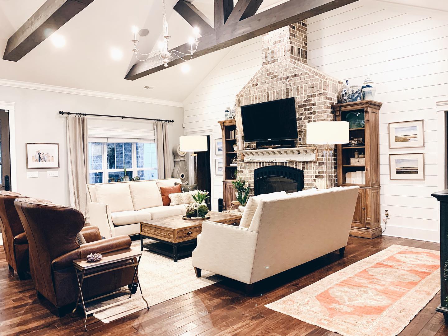 19. the Weathered Barnwood Mantelpiece with a Trio Of Copper Lanterns