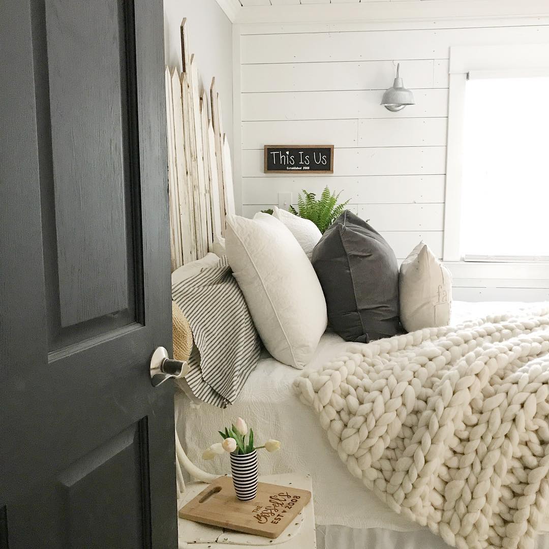 23. Wooden Ladder Shelves and Woven Basket Accents In a Cozy Farmhouse Retreat