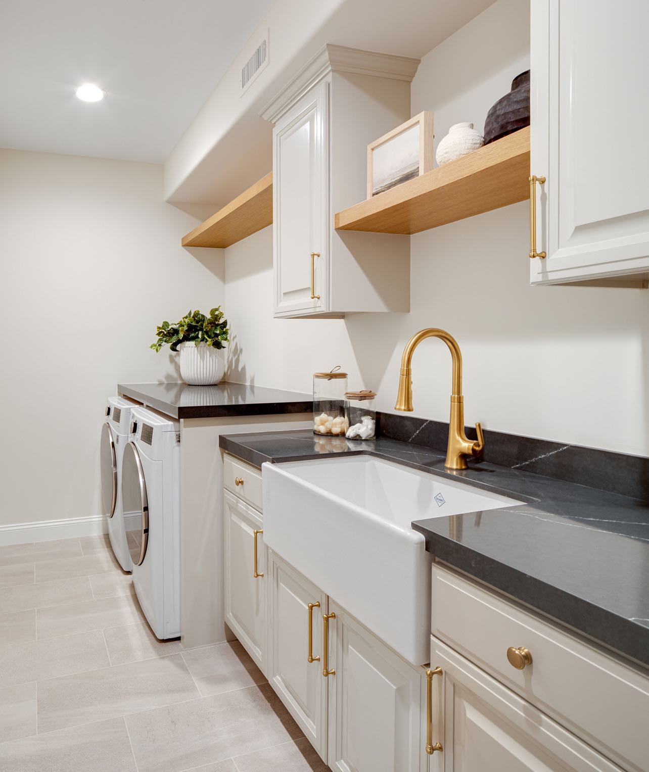 26. Tumbling Dryer Nooks and Faux Brick Backsplash In a Compact Laundry Space