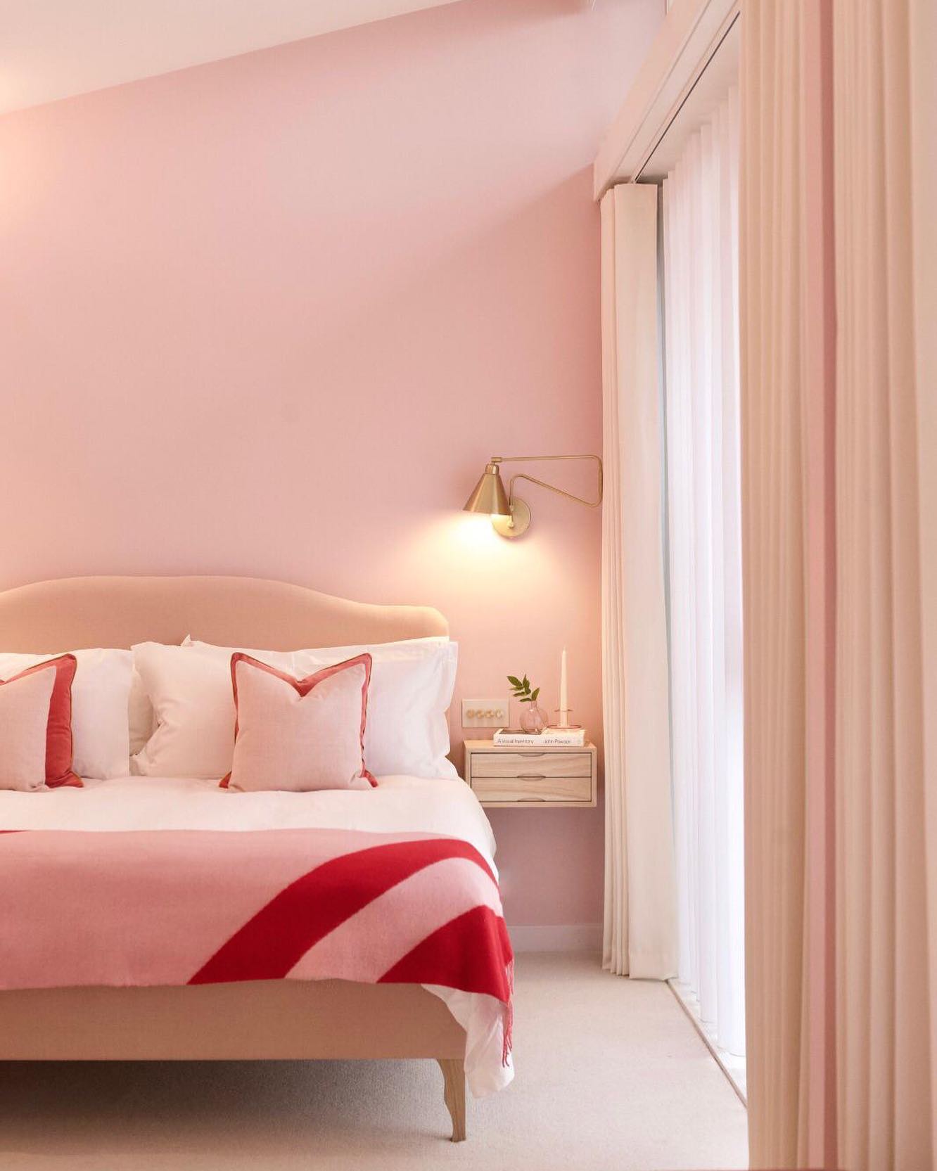 66. Whimsical Cherry Blossom Canopy Over a Vintage Pink Bed