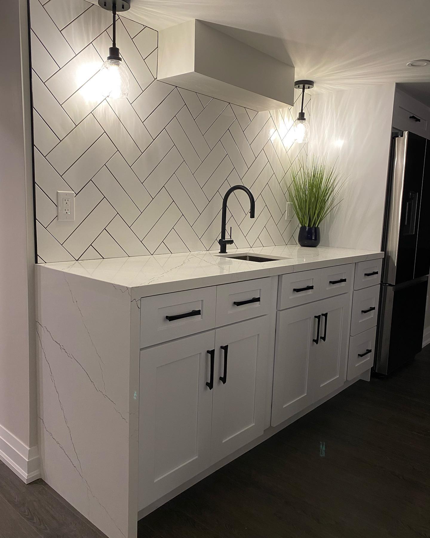 42. Glossy Black Hexagons and Copper Accents: a Bold Kitchen Backsplash