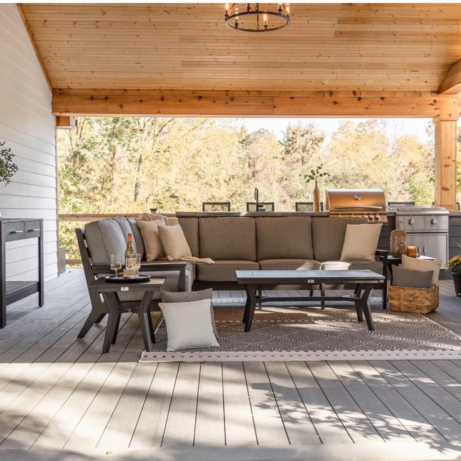 21. Patio Swing with Sunflower Yellow Cushions Overlooking a Lush Green Lawn