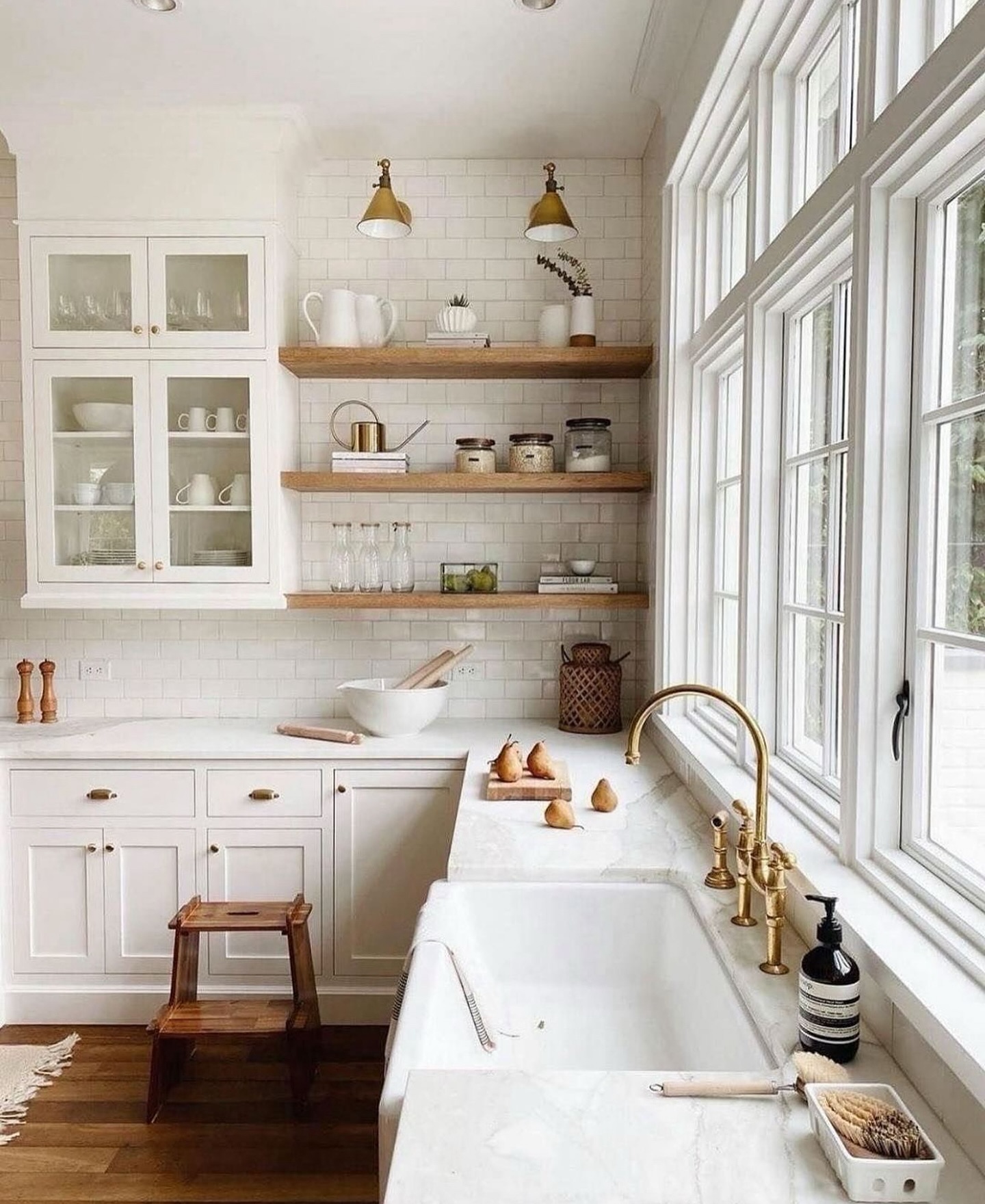 28. a Symphony Of White: Fluted Panels and Geometric Brass Handles In a Pristine Kitchen
